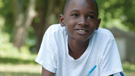 Boy in grass photo